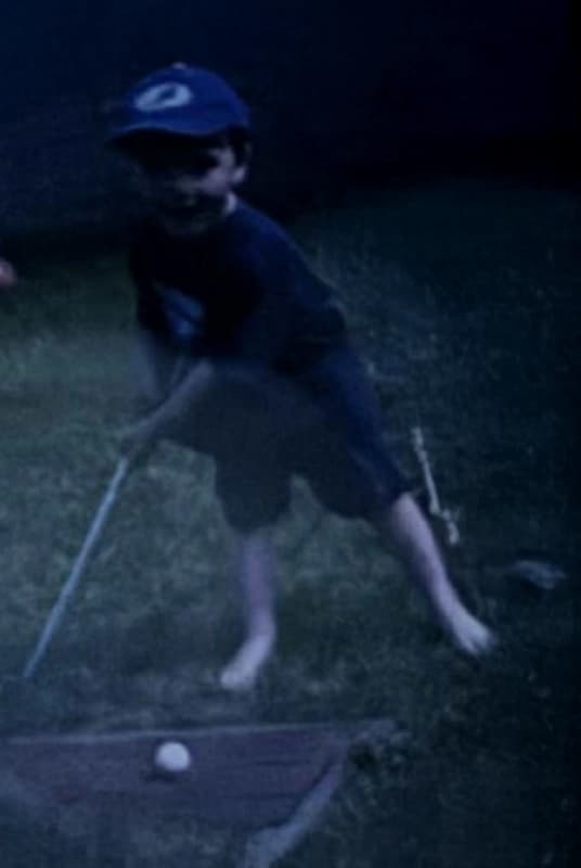 Young Ethan playing golf