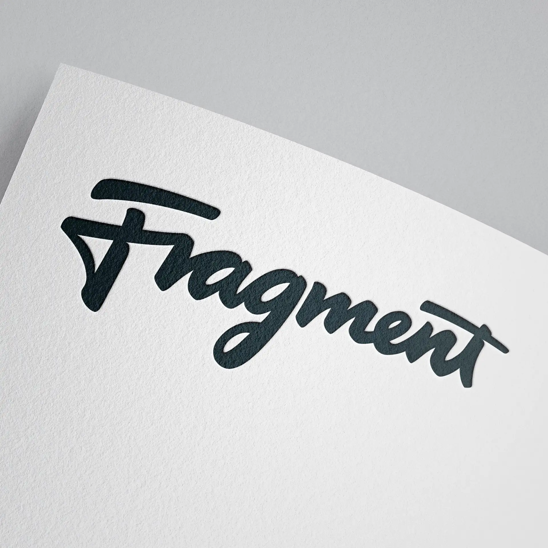 Fragment logotype printed on textured paper